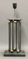 Lot 205 - An iron and patinated table lamp base