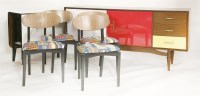 Lot 670 - A teak ebonised and laminated dining room suite