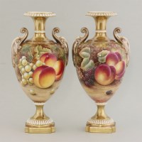 Lot 1093 - A pair of Royal Worcester urns