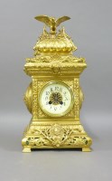 Lot 1313 - A late 19th century ornate brass mantel clock