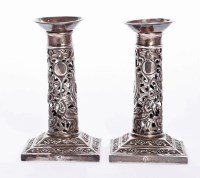 Lot 24 - A pair of Chinese silver candlesticks