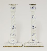 Lot 7 - An unusual pair of enamel Candlesticks