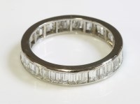 Lot 521 - A diamond set full eternity ring