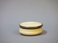 Lot 133 - A 19th century turned ivory and copper mounted pot and cover