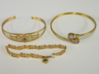 Lot 55 - A 9ct gold amethyst and diamond bangle