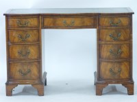 Lot 718 - A modern serpentine fronted writing desk