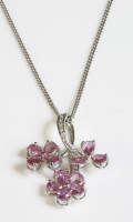 Lot 506 - An 18ct white gold sapphire and diamond pendant
