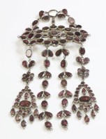 Lot 264 - A flat cut garnet stomacher