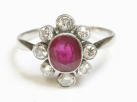 Lot 409 - An Art Deco ruby and diamond oval cluster ring