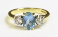 Lot 440 - An 18ct gold aquamarine and diamond three stone ring