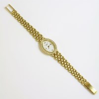 Lot 457 - A ladies' 18ct gold Longines quartz diamond set bracelet watch