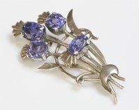 Lot 411 - A gold and silver sapphire set spray brooch