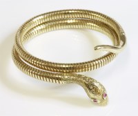 Lot 474 - A 9ct gold coiled snake or serpent bangle by Cropp & Farr