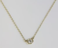 Lot 488 - An 18ct gold single stone diamond pendant