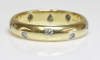 Lot 494 - An 18ct gold diamond set Tiffany & Co. 'Etoile' wedding ring