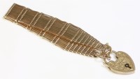 Lot 358 - An Edwardian twelve row gold gate bracelet