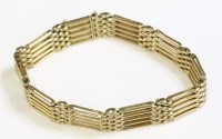 Lot 362 - An Edwardian five row gold gate bracelet