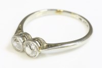 Lot 376 - An Art Deco two stone diamond ring