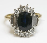 Lot 443 - A sapphire and diamond oval cluster ring