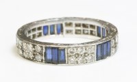 Lot 379 - A sapphire and diamond full eternity ring