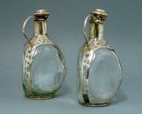 Lot 190 - A pair of Mexican silver mounted claret jugs