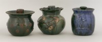 Lot 45 - Three Elton 'Sunflower' pottery barrels and covers