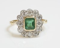 Lot 496 - An emerald and diamond rectangular cluster ring