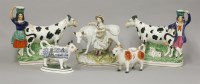 Lot 1059 - (WH) A pair of Staffordshire spill vases