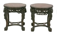 Lot 387 - A pair of carved rosewood Vase Stands