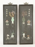 Lot 159 - A pair of stone Appliqué Panels