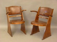 Lot 595 - A pair of oak Arts and Crafts chairs