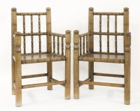 Lot 588 - A mid 19th century unusual pair of vernacular oak turners’ chairs