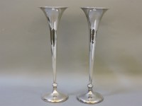 Lot 221A - A pair of silver trumpet form vases