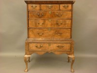 Lot 635 - An 18th century walnut chest on stand