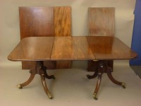 Lot 782 - A George III and later twin pillar dining table