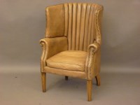 Lot 781 - A leather barrel back armchair