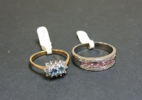 Lot 54 - A 9ct gold blue topaz and diamond double cluster ring