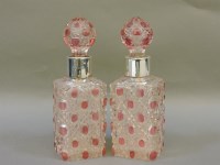 Lot 221 - A pair of silver coloured cut glass scent bottles