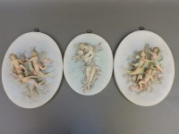 Lot 318 - A pair of German biscuit porcelain wall plaques