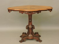 Lot 677 - A walnut centre table