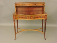 Lot 645 - A mahogany serpentine front desk