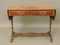 Lot 757 - A reproduction walnut sofa table