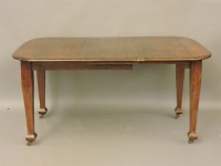 Lot 608 - An Edwardian walnut extending dining table
