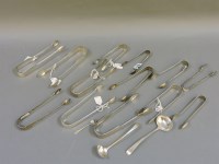 Lot 153 - A collection of Georgian and later silver sugar nips and tongs
