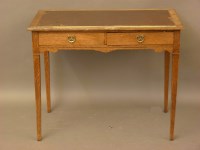 Lot 627 - An Edwardian oak writing table