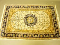 Lot 733 - A Persian cream ground blue and olive carpet