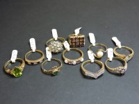 Lot 58 - A 9ct gold opal and amethyst half hoop ring