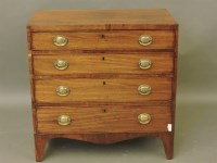 Lot 660 - A walnut chest of four long drawers