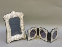 Lot 220 - A triple silver photograph frame