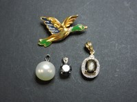 Lot 102 - A 9ct gold black sapphire and diamond oval cluster pendant